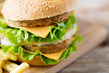 Image showing close up of hamburger or cheeseburger on table