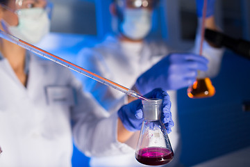 Image showing close up of scientists making test in lab