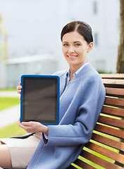 Image showing smiling business woman with tablet pc in city