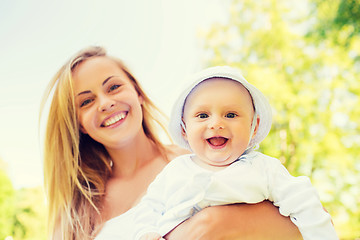 Image showing happy mother with little baby in park