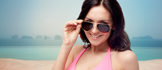 Image showing happy woman in sunglasses and swimsuit