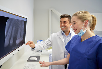 Image showing dentists with x-ray on monitor at dental clinic