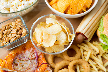 Image showing close up of fast food snacks and drink on table