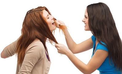Image showing two teenagers having a fight and getting physical
