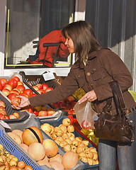 Image showing Woman buying fruits