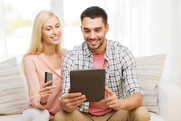 Image showing happy couple with tablet pc and credit card