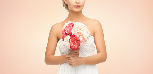 Image showing bride or woman with bouquet of flowers