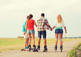 Image showing group of teenagers with roller-skates