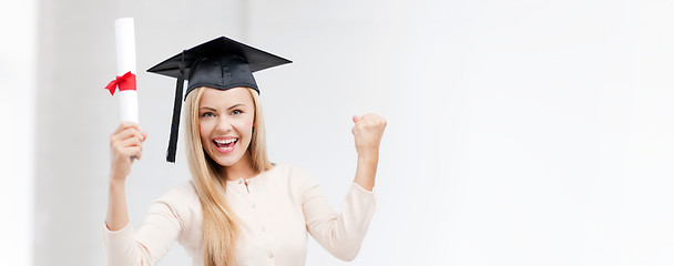 Image showing student in graduation cap with certificate