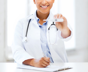 Image showing doctor with thermometer and stethoscope