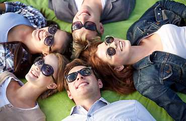 Image showing group of students or teenagers lying in circle