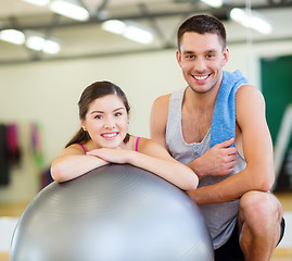 Image showing two smiling people with fitness ball