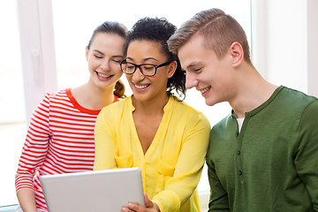 Image showing smiling students with tablet pc at school