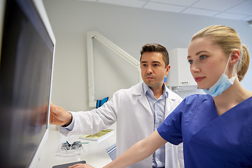 Image showing dentists with x-ray on monitor at dental clinic