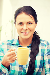 Image showing lovely housewife with mug