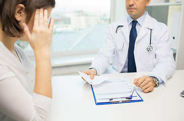 Image showing close up of doctor and woman meeting at hospital