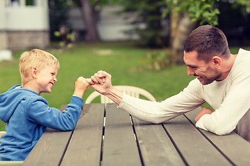 Image showing happy family in front of house outdoors