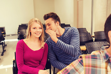 Image showing group of smiling students in lecture hall