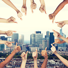 Image showing human hands showing thumbs up in circle