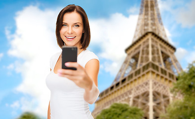 Image showing woman taking selfie with smartphone in paris