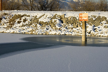 Image showing No Swimming Sign on the Frozen Lake