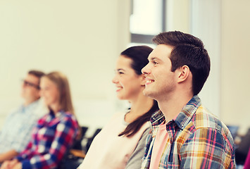 Image showing group of smiling students in lecture hall