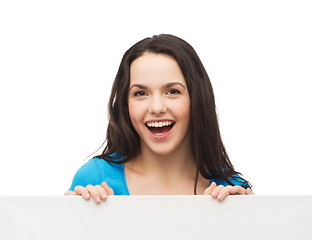 Image showing smiling young girl with blank white board