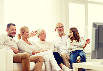 Image showing happy family watching tv at home