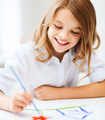 Image showing little girl painting at school