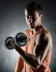 Image showing young man with dumbbell