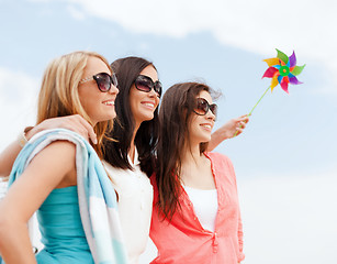 Image showing girls with windmill toy on the beach