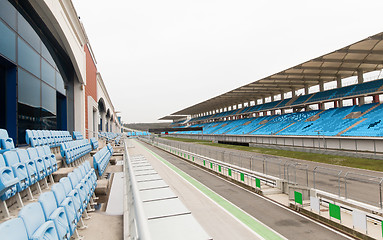 Image showing empty speedway and bleachers on stadium