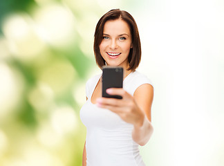 Image showing woman taking selfie with smartphone