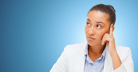 Image showing african businesswoman looking up and thinking