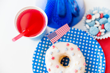 Image showing donut with juice and candies on independence day