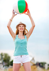 Image showing girl playing ball on the beach