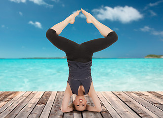 Image showing happy young woman doing yoga exercise