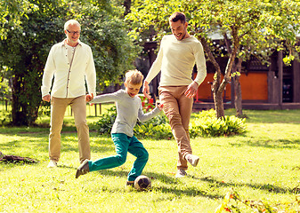 Image showing happy family playing football outdoors