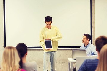 Image showing group of smiling students and teacher in classroom