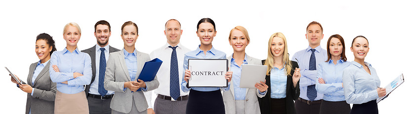 Image showing group of happy businesspeople holding contract