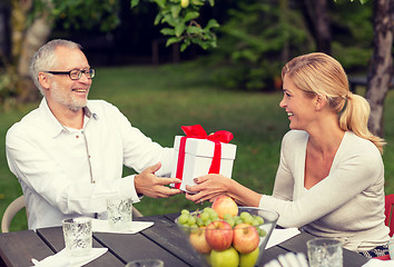 Image showing happy family having holiday dinner outdoors