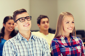 Image showing group of smiling students in lecture hall