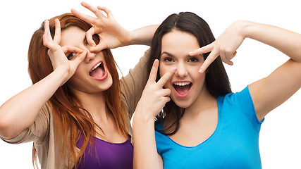 Image showing two young teenagers making faces