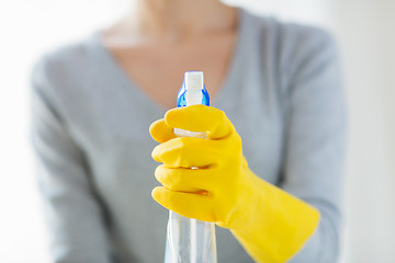 Image showing close up of happy woman with cleanser spraying