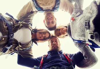 Image showing group of smiling friends with backpacks hiking