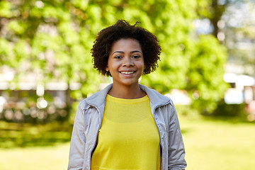 Image showing happy african american young woman in summer park