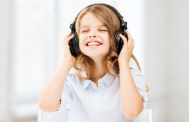 Image showing girl with headphones listening to music