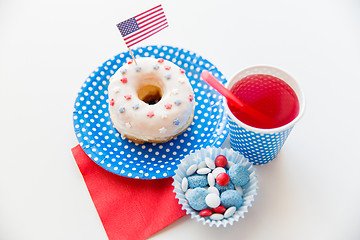 Image showing donut with juice and candies on independence day