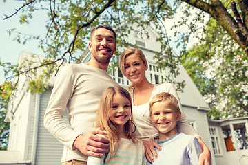 Image showing happy family in front of house outdoors