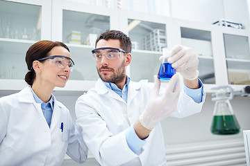 Image showing young scientists making test or research in lab